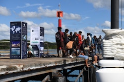 Students in front of Energy Observer boat