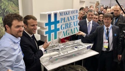 Victorien, Emmanuel Macron and Nicolas Hulot standing next to the Energy Observer's replica