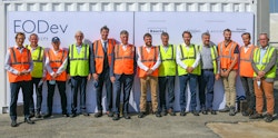 A group of men with yellow and orange vests