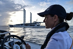 A crew member sailing with the tender