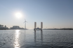 Energy Observer sailing with wind turbine behing
