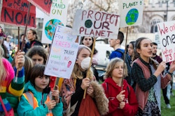 LONDON, UK - February 15, 2019: Protestors with banners at a Youth strike for climate march in central London